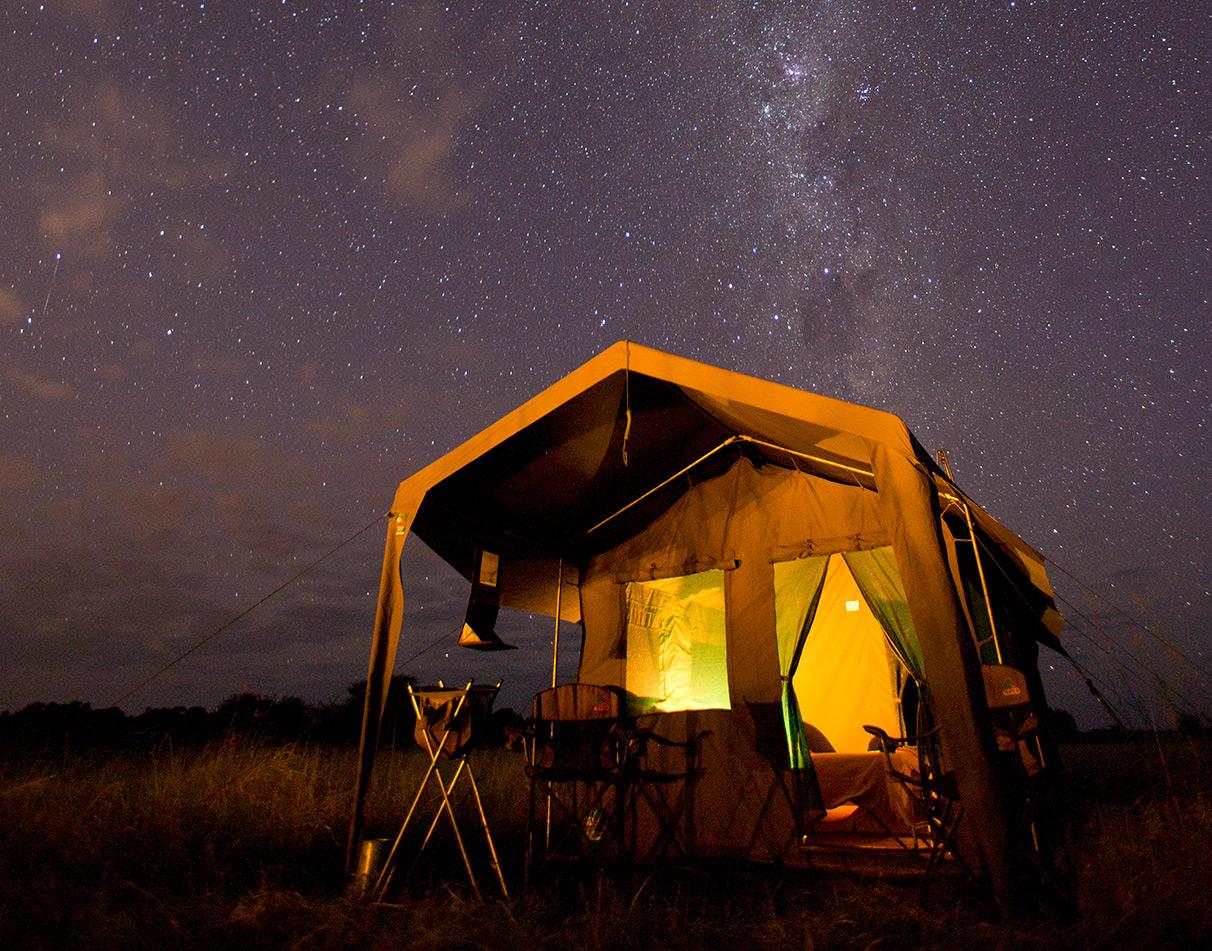 Guest tent at mobile camp at night